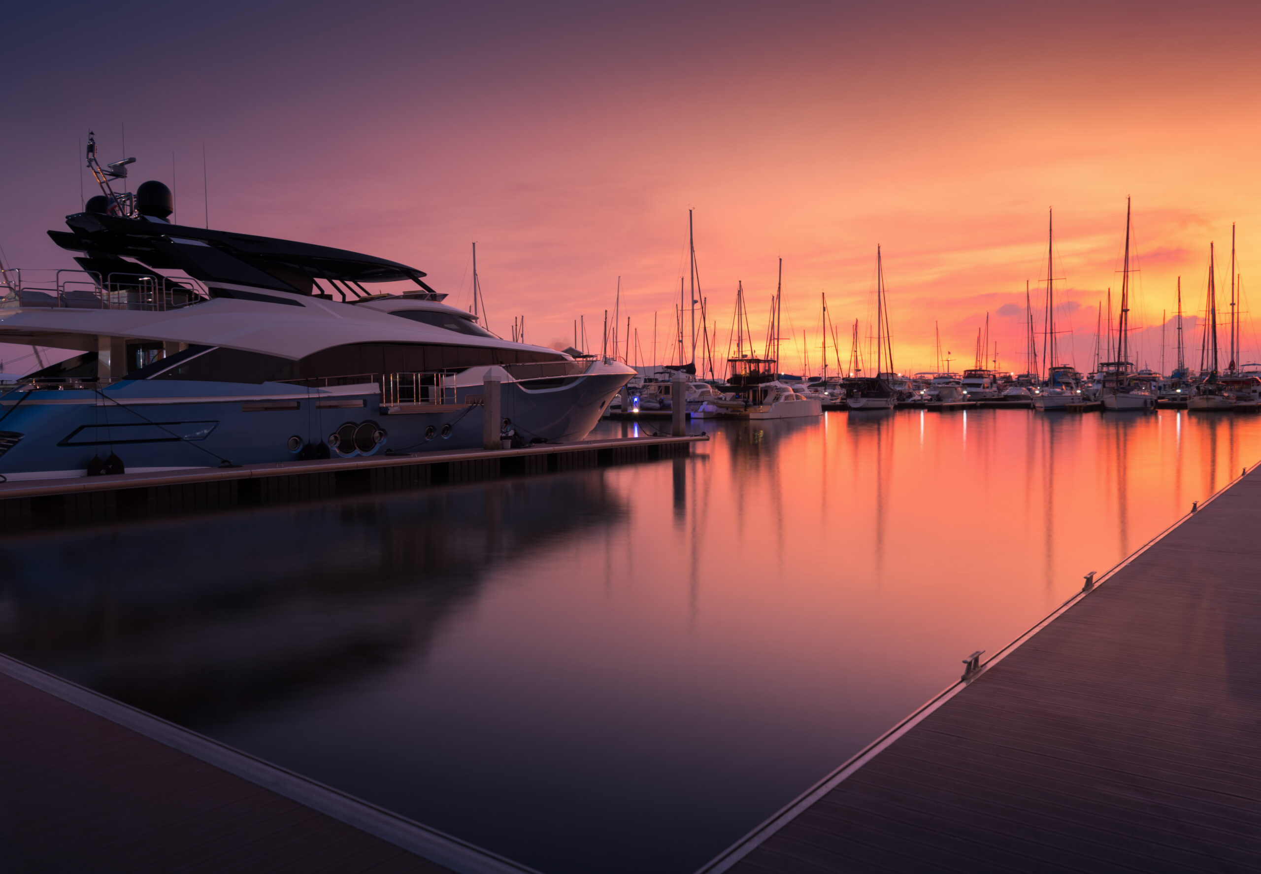 yacht on the doc with petty sunset